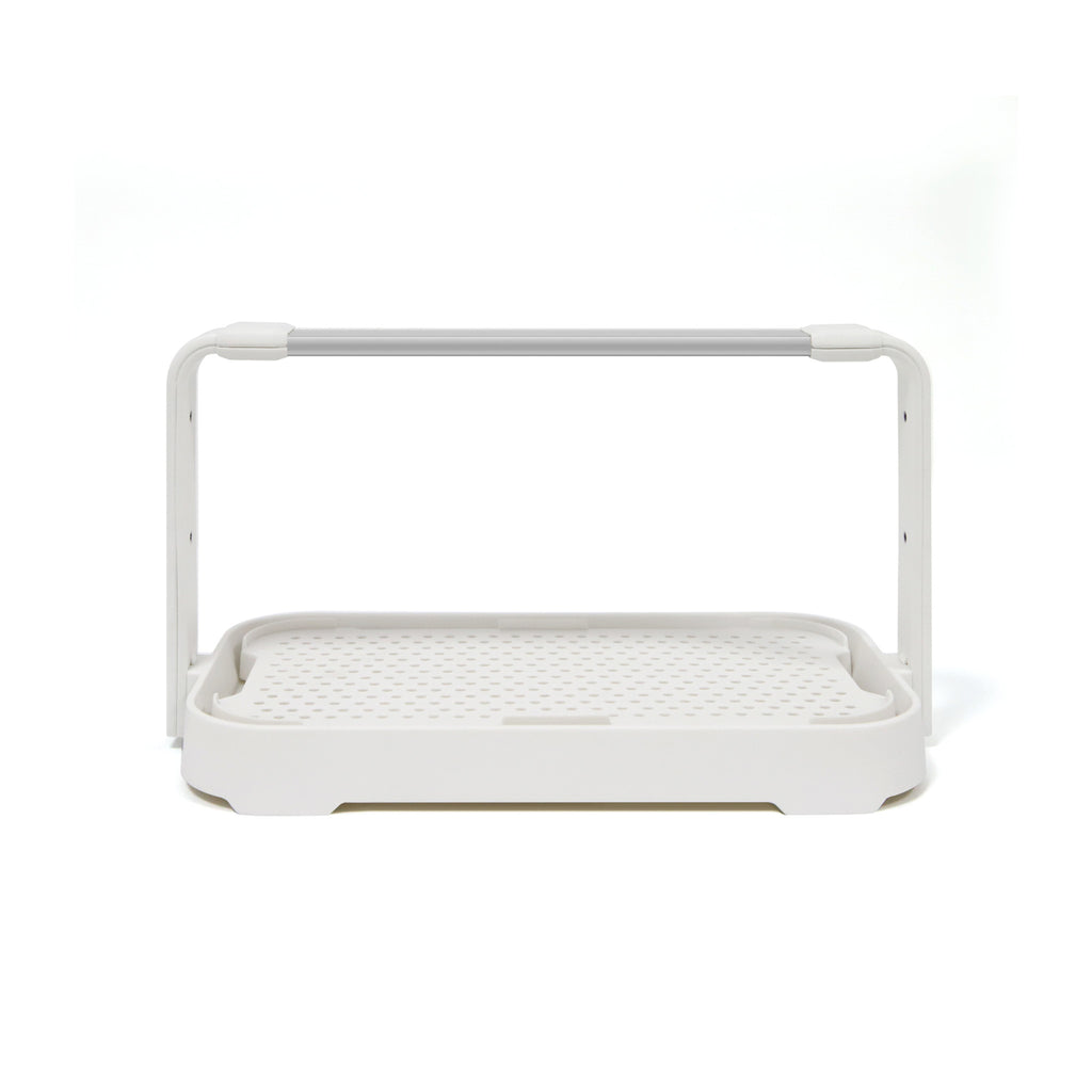 Entry-level white microgreen starter garden system with LED grow light used for indoor gardening.