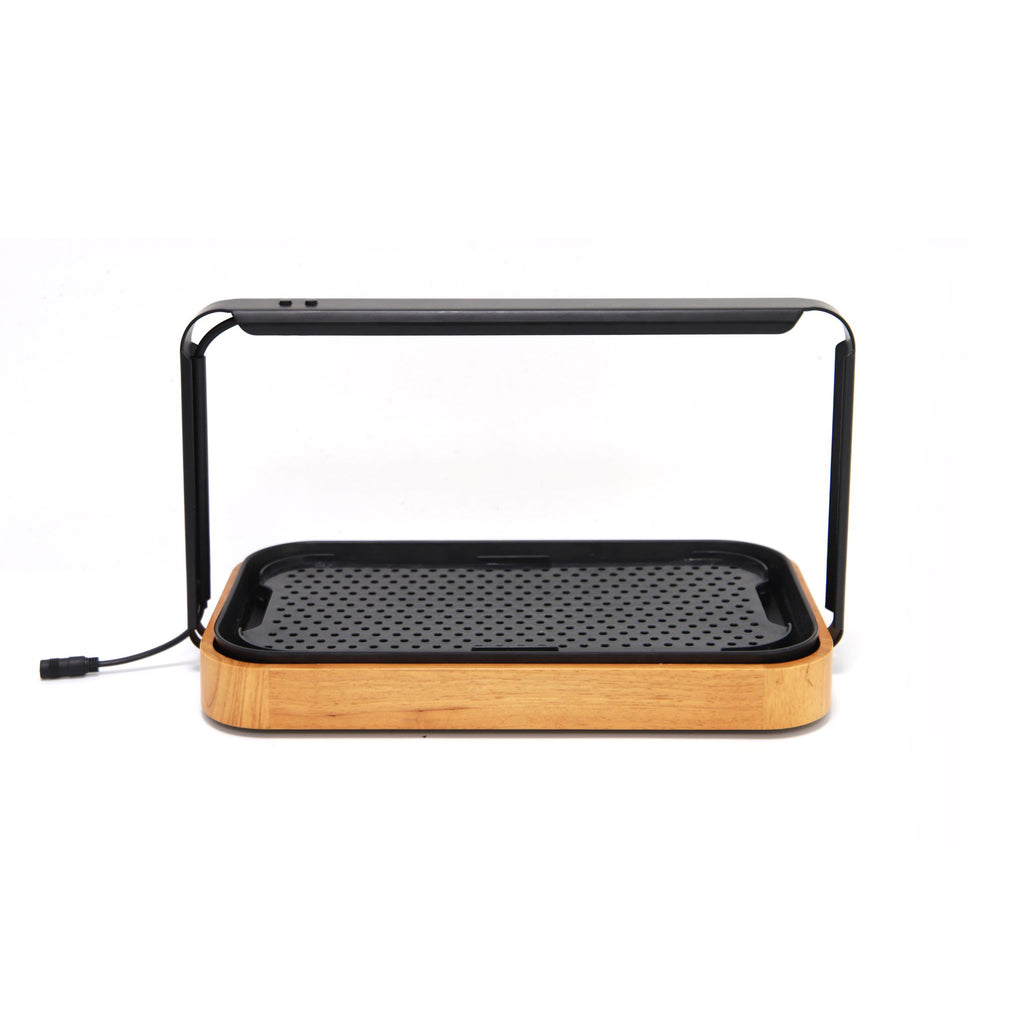 Premium microgreen garden system featuring a stylish bamboo base and integrated LED grow light for indoor gardening.