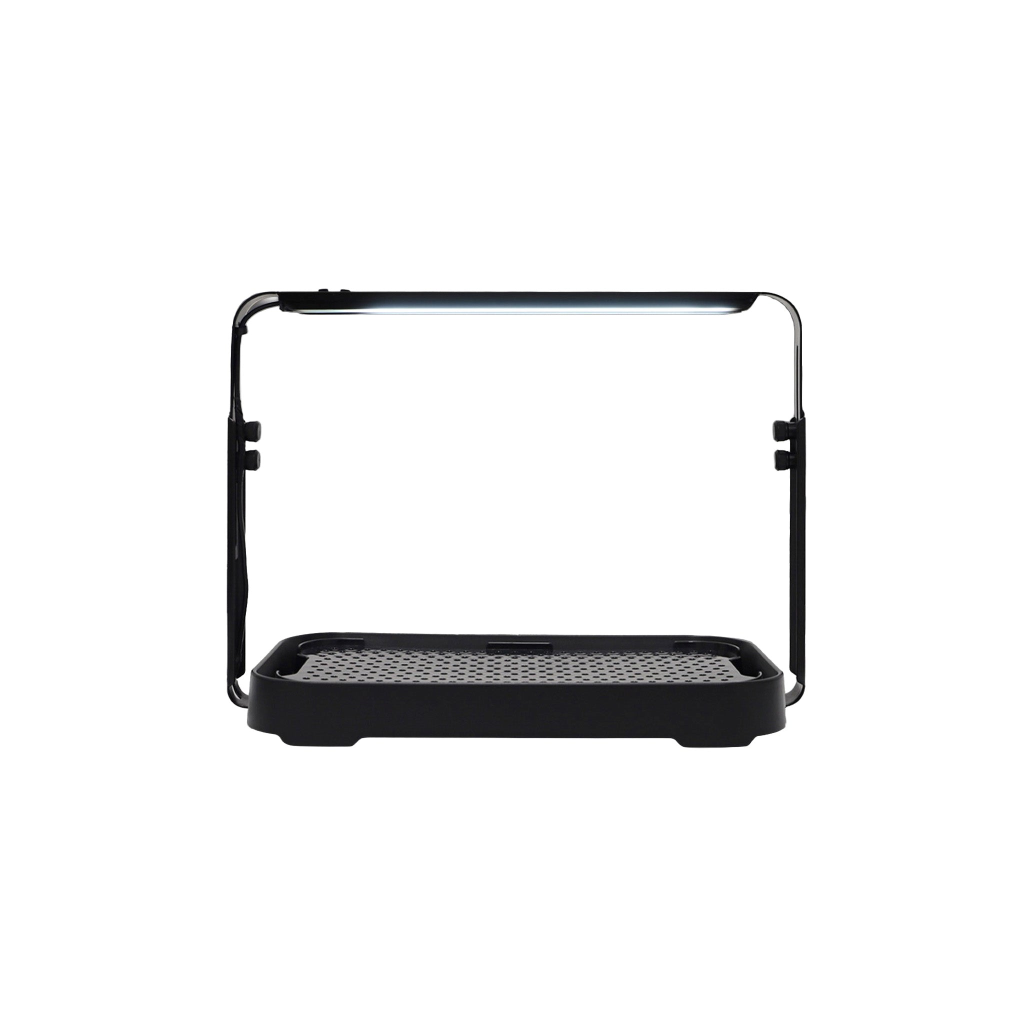 Black microgreen garden system with a height-adjustable LED grow light used for indoor gardening.