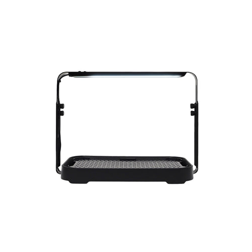 Black microgreen garden system with a height-adjustable LED grow light used for indoor gardening.